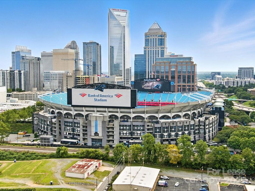 Live at the center of it all in this stunning Uptown Charlotte loft, just **one block from Bank of America Stadium.** Whether it’s Panthers football, Charlotte FC, or concerts, you’ll enjoy unmatched convenience with gated parking for one vehicle included and the option for free residential street parking tags—making event days effortless.

This two-bedroom, two-bath loft (one open loft bedroom overlooking the main living area) blends urban industrial style with high-end finishes. Soaring ceilings, polished concrete floors, and oversized windows flood the space with natural light. The chef’s kitchen was recently gutted and rebuilt to luxury standards, featuring Miele appliances (including built-in luxury Miele espresso machine, oven with steam spritzing feature, induction cooktop, knock-to-open dishwasher and hidden custom refrigerator... ALL MIELE!), sleek custom cabinetry, modern tile backsplash, and an oversized island ideal for entertaining. A bar with wine fridge and humidor adds to the upscale feel (smoking permitted on private front porch).

The open-concept main living space flows seamlessly for both daily life and entertaining. Upstairs, the lofted second bedroom adds flexibility for guests or a home office. The primary suite offers privacy, generous storage, and a spa-inspired bath with a glass-enclosed shower and soaking tub.
Additional features include:
• Two bedrooms and two full baths
• Cozy electric fireplace
• Mounting installed for Samsung Frame TV
• Flex space- perfect for home office, recreation room, etc.
• Recently renovated chef’s kitchen with all Miele appliances
• Bar with wine fridge and humidor
• Abundant storage (rare for city living)
• Gated parking plus free on-street residential parking with tags
• Industrial-style design with polished concrete floors and oversized windows
• Pet-friendly

• Flexible lease terms: 6 or 12 months

Next door to Hygge Coworking and just steps from restaurants, breweries, the light rail, and all that Uptown and South End have to offer, this property delivers the closest thing to Manhattan loft living in Charlotte.

Offered by owner/agent. Available for immediate lease.