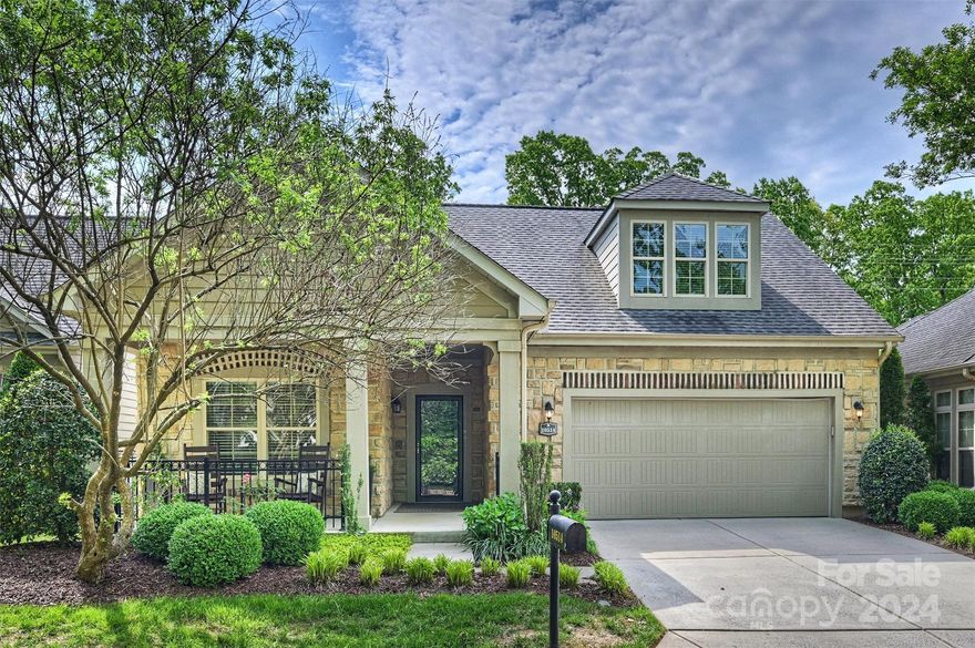 Stroll up the sidewalk and be greeted with lovely perennials and a welcoming rocking chair front porch. Sit and enjoy morning coffee or an afternoon glass of iced tea in this peaceful, lovely setting. Home is flooded with natural light and has engineered wood floors throughout the main level. Primary bedroom has extra sitting area, walk in closet and walk in shower. Secondary bedroom and full bath are also on main, with third bedroom/full bath and huge bonus room upstairs. Endless options for this large space! Enjoy your favorite sporting event on a fabulous patio that includes a custom water feature as the backdrop, truly an oasis for outdoor living. Community includes 17 Epcon built open floor plan patio homes on a private street. Access to pool, tennis/pickleball, playground and basketball courts at Allyson Park subdivision across the street. South Charlotte/Ballantyne location is ideal with nearby shopping and restaurants at in Ballantyne, Blakeney and Stonecrest. Minutes to I-485.