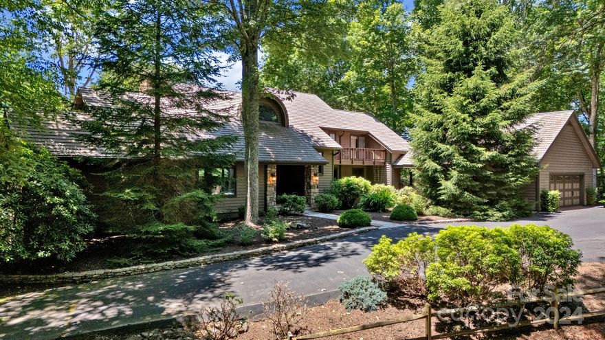 Stunning views from custom designed home in Valle Cay gated community convenient to Valle Crucis & Boone. Designed by architect David Patrick Moses, this unique home seamlessly blends indoor & outdoor living w/ three levels of elegance & comfort. Main level includes a dining area & chef's kitchen. The primary bedroom on main w/ beautiful mountain views, a renovated bath w/ whirlpool, 2 walk-in closets. An office w/ a full bath can also serve as a bedroom. Laundry/mudroom on main w/ covered access to oversized 2-car garage & a home gym. Upstairs are 2 en-suite bedrooms w/porch. The lower level includes a large living room/flex space, wine cellar, & ample storage. Enjoy sunsets from expansive decks & screened porch on the western side, eastern flagstone patio for sunrises. Offered furnished w/ few exclusions, features include a generator &  50 yr DaVinci composite roof. Valle Cay offers hiking trails, lakes for canoeing, fishing, & covered pavilion. Come see this "Hidden Gem" today!