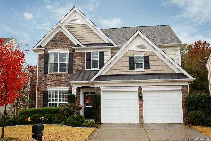 Wow! This BEAUTIFUL Home Flows with Fabulous Outdoor Patio overlooking fenced, level yard! Style & Grace flow with dark hardwoods, wainscoting, and columns. 2 Story Great Room with gas fireplace and wall of windows. Gourmet Kitchen with Work Island, stainless GE appliances, rich cabinetry and solid surface counters. Luxurious Master Suite! Storage Galore. Set in prime location close to everything!