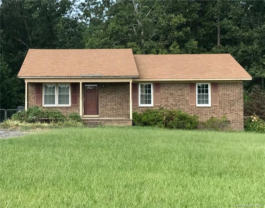 Charming ranch sits on a great lot with a HUGE fenced backyard. NEW laminate wood floors in living, dining, kitchen and hall.   Quiet country living. Sit on the front porch and look out into the pasture across the street!