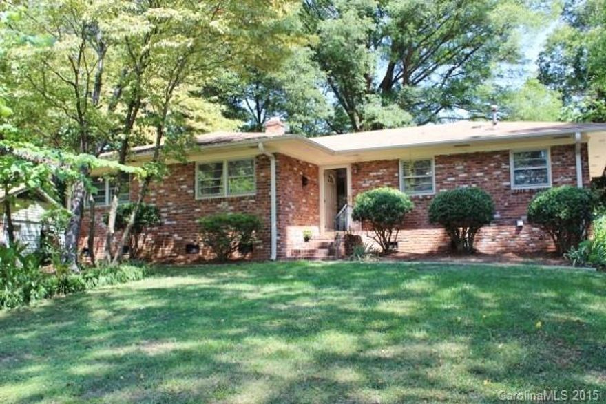Fresh, clean and bright! Picture yourself here!  Beautiful all brick ranch home in older neighborhood with a mature setting. Hardwood floors; large, eat in kitchen; 3 bedrooms; 1.5 baths; closed in porch and utility room; pass through/bar; fenced in back yard; sheds to remain; washer/dryer and refrigerator to remain; newer appliances. HVAC is only 2 years old, newer gas hot water heater. 15 min to uptown, close to UNCC, near coming light rail line. Home Warranty included!