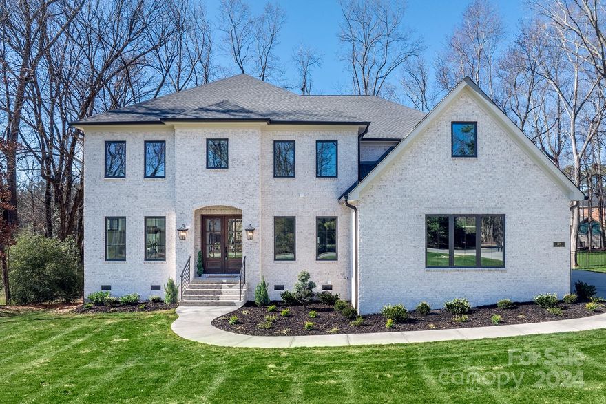 Extraordinary custom built luxury home in Matthews! Primary bedroom on main. This luxurious property sits on a gorgeous half acre lot in a neighborhood w/ no HOA. As soon as you walk in the all-brick home you will see the solid white oak floors throughout, & as you step into each bathroom you will be blown away by the custom tile work specific to the space. As you venture through the home you will notice the hand picked light fixtures all throughout the home & the massive 2-story windows allowing plenty of sunlight. The builder made sure to include a laundry room on both floors for easy access, w/ each one having a sink & built in cabinets. As you will see, the kitchen is any chef's dream; equipped w/ 2 sinks, a wine cooler & 2 dishwashers. The house is pre-wired for a sound system, cat 5, & comes with a central vacuum system. You will also find an attached 3 car garage with insulated garage doors. Conveniently located less than 3 miles from 4 different plazas. Agent related to seller.