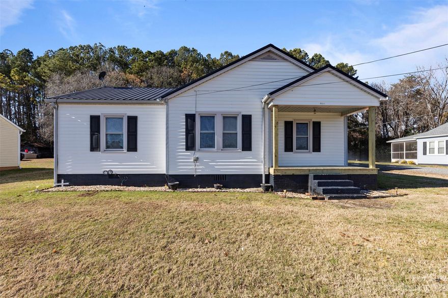 Charming 1951 RANCH home, renovated with NEW LPV flooring, fresh paint from ceiling to trim, updated light fixtures throughout home.   Refinished cabinets, a revamped covered front porch with new wood post that add to its allure.   The TIN roof preserves the home's original charm. Covered carport with concrete pad that could also be used for back patio seating. Storage shed for storing all the extras. This delightful, modernized vintage gem is ready for a new owner.   Stainless Steel oven is being installed soon.