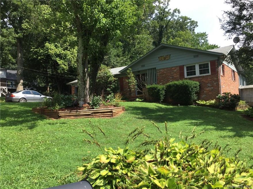 Nice home convenient to downtown Asheville, Mission Hospital and just minutes to shopping and restaurants in South Asheville. Enjoy one level living with large fenced back yard and outbuilding/workshop. Spacious interior includes fireplace in the living room and additional den that leads out to the back patio. Plenty of additional storage and work space in the unfinished basement. Updates include new furnace in 2016 and windows in 2008.