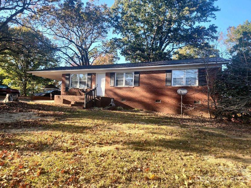 If you are looking for a brick ranch on 32+- acres of land, located near the NC/SC state line, this one may be for you! There is no wasted space in this 3 bedroom, 1 bath with open concept kitchen, dining and living space.  The house is surrounded by large established shade trees and is situated on a knoll, that overlooks the field in front of the house. The acreage behind the house affords a ton of space to roam on or cultivate into your dream spot. Bring some fencing materials and your horses or just use this property for all of its outdoor enjoyment possibilities.
