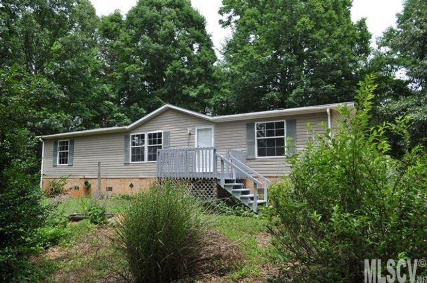 Imagine “home’ being nestled on 4.87 acres of country wooded serenity. A country setting filled with the sounds and views of nature in the privacy of your own front and back yard. A spacious 3 Bedroom 2 Bath home with natural light flowing throughout and views of the property. Large Master Bedroom with its own Master Bath accented with a double vanity, separate tub and shower. A large Kitchen with countertop and cabinet space for entertaining and dining. The Laundry Room provides extra storage space with organizers for your storage needs. New paint and carpet have been added to the home. Acreage provides space for outdoor storage and room for your pets to roam. Property located in the country, but conveniently minutes away from local shopping, eateries, and more.