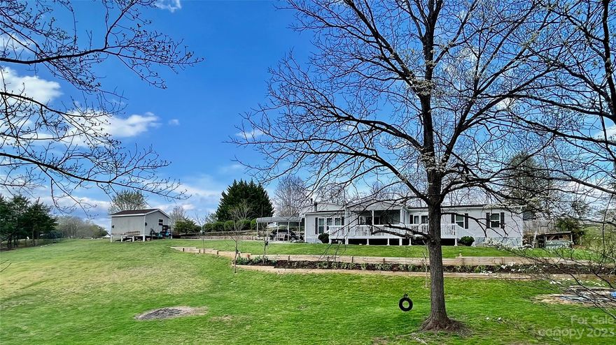 Mint Condition, 3 BR, 2.5 bath, located on private, nicely landscape .91 acre lot at end of cul-de-sac, shared well w/8 homes -FHA financing cannot be obtained, great room w/ vaulted ceilings, updated kitchen w/large island, covered front and back decks perfect for outdoor living, all one level living, AHS Home Warranty, 2-car carport, storage shed, convenient location, less than 20 minutes to Downtown Asheville.