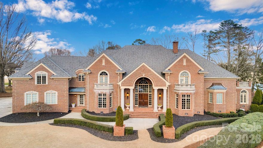 Nestled between the 5th & 9th holes of the prestigious Peninsula Golf Club, this custom-designed mansion is a masterpiece, built w/ steel frame construction, hurricane-resistant windows & a 50-year roof. Offering nearly 11,000 SF of unparalleled luxury, this home sits on a double lot & features 7 bedrooms, including 3 primary suites & 7.5 spa-inspired bathrooms w/ striking marble finishes.  Inside, every detail exudes elegance, from the intricate millwork & soaring wood crown moldings to the exquisite lighting. The gourmet kitchen, complete w/ a grand island, effortlessly blends into the spacious living areas, while four gas fireplaces set a cozy, inviting tone. The owner's wing is a private retreat, featuring a morning coffee bar, a sunroom & a secluded deck. With 2 laundry rooms, a full 2nd-floor kitchen, and an elevator, this home is perfect for multi-generational households or as a caregiver space. Conveniently located near the Peninsula Golf club & Yacht club amenities, enjoy resort-style living with golf, tennis, pools, boating & more.