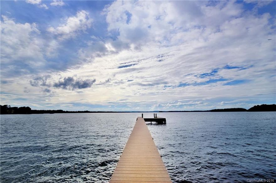 LOCATION LOCATION!!! Premier Waterfront Lot on Lake Norman. Spectacular Views, and the Most Beautiful Sunset on the Lake! No HOA. Bring your own Builder and start living that Lake Norman Lifestyle! Home is being sold AS IS.  Very Convenient to Shopping, Restaurants, Parks and The Peninsula Golf and Club. Adjacent lot MLS 3179926 is also available.