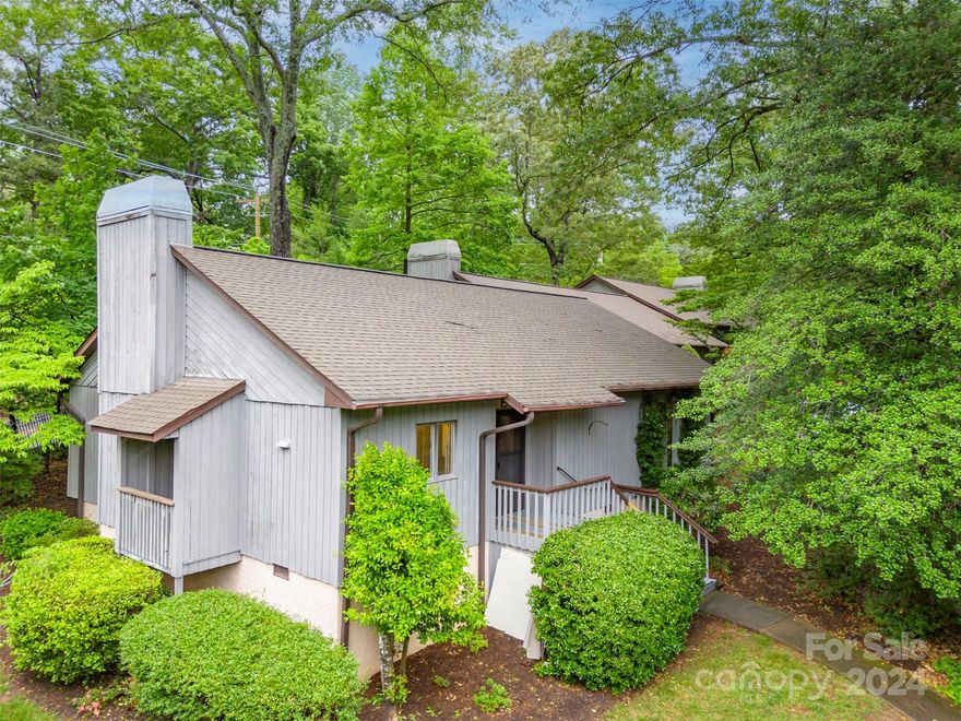 Enjoy easy living in this comfortable one-level end-unit condo within walking distance of downtown Tryon! This 2-bedroom, 2-bathroom condo offers the perfect blend of style and functionality. Step inside and discover beautiful hardwood floors and a wood-burning fireplace. Relax and unwind on the screened porch, which is ideal for enjoying your morning coffee or al fresco dining. This pet-friendly condo (dogs and cats, up to 2 total) allows you to bring your furry companions along. Plus, enjoy the convenience of having your water, sewer, trash, exterior maintenance, and lawn care all included in the HOA dues of $305 per month. There's also a separate annual master insurance assessment of approximately $1000. Parking is a breeze, with two designated parking spaces in front of your unit and additional guest parking available.  A large storage room beside the screened porch is great for organizing your belongings. Enjoy all that charming Tryon offers, just a short distance away.