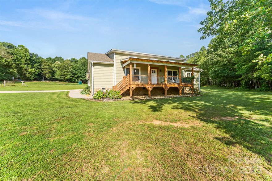 This 2022 custom-crafted home was built by an exceptional builder and lived in by an artist who loved every inch of it. Set on over an acre of open, rural land with no HOA, this 3BR/2BA beauty is full of thoughtful details: soaring ceilings, a showstopping floor-to-ceiling Tennessee stone fireplace and a kitchen that’s pure craftsmanship with solid wood cabinetry, live-edge walnut island, and a one-of-a-kind pantry featuring ambrosia maple, cherry, white oak & walnut. Even the bathrooms bring the charm with hand-carved accents & unique vanities. Favorable split bedroom plan features a light & airy primary suite with vaulted ceilings, custom walk-in closet and gorgeous ensuite bath with walk-in shower. Need space to create, play, or work? The large flex room has you covered and is heated and cooled separately from the home. Front porch sittin’ and back patio chillin’ are both on the menu, and there’s plenty of room out back if a pool is on your wishlist. Attached double car garage.