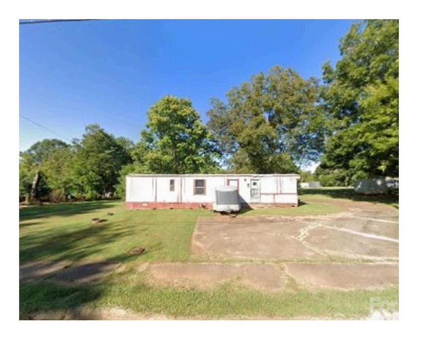 Nice level lot has an old mobile home (1983 Edge, 48'by 14')with no value.  If someone wants, they could fix the mobile home to make it livable or replace it with a new or newer model.  Sellers are not removing the mobile home in the event a new owner would want to replace the home there are time constraints by the City of Newton/Catawba County as to how long the lot could be vacant prior to placing a new home on the lot. Storage Shed on property. 
To clarify schools, per Catawba County Schools elementary is S Newton, middle is Newton-Conover Middle School, High school is Newton-Conover High School

Mobile Home has been secured for non-entry due to risk of injury.  DO NOT ATTEMPT TO ACCESS THE INSIDE OF MOBILE HOME!