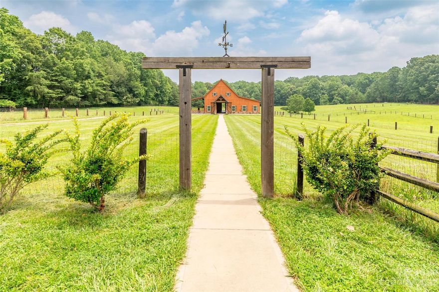 Nestled on almost 8 acres, this elegant yet rustic barn is the perfect setting for a wedding, anniversary/birthday party, and any other special event or reception. With over 2,500 heated square feet of interior space, you'll discover room to host almost 300 guests, two bathrooms, soaring ceilings, and an elegant chandelier.  The 806 square foot covered terrace has a breathtaking view of this countryside estate. On the property, you'll also find a stunning main house, a 2-apartment guest house (perfect for a bridal suite), and another smaller all brick home. Don't miss the huge chicken coop, the 5-bay storage building for tractors/vehicles, the fenced pastures, and the separate gym building. In addition to running a successful event venue, this estate would be great for several rental opportunities, multi-generational living, and experiencing farm life at it's finest. Please google search Barn 76 to see photos of all the highly successful events in the past. Very unique opportunity.