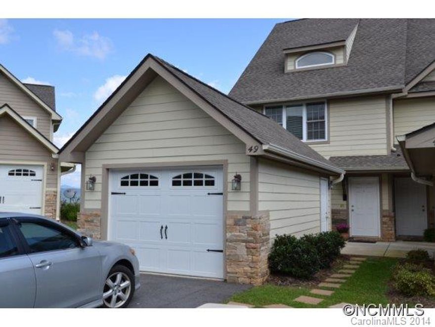 S.S. appl. in kitchen.Custom granite counter tops in kitchen and breakfast bar.  Main level and 2nd floor have terraces Must see custom town house with three bedrooms and three baths. Handsome cherry hardwood floors on main level. with mt. views. Patio on lower level also open to the views. Master b/r on 2nd level and has a walk-in closet. Over sized garage. Gas fire place. Bonus room/office on lower level. Great 2nd or vacationtownhouse.