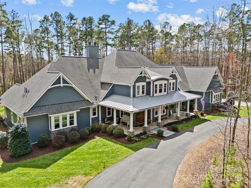 Exceptional Opportunity! Custom craftsman style home in gated equestrian community. Situated on almost 7 secluded acres, this home offers the ultimate in privacy with an adjacent ten acre preserve - truly a sanctuary. Enjoy nature in this wooded setting via the heated, saltwater pool, spa, 4-mile hiking/horse trail, garden and chicken coop. Wide plank solid oak floors, primary bedroom and guest suite on main level. Chef's kitchen includes 30" SubZero refrigerator & freezer, Wolf gas range with double ovens, expansive 9-foot island, 2 Bosch dishwashers, separate prep sink and walk-in pantry. Wet bar includes 200-bottle wine refrigerator & ice maker. Control4 Smart technology app for hvac, music, tv, exterior cameras & lights. Over 1500sf of covered outdoor living space with vaulted ceiling, wood burning fireplace, 42" Lynx built-in grill, XL PrimoOval smoker, sink, audio and tvs. Laundry room on each floor, 3-car oversized garage, 2 tankless water heaters, generator, irrigation, alarm.