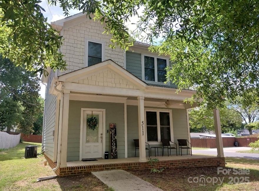 Priced to sell Quickly!Welcome to this practically new, two-story, turn-of-the-century style home, perfectly situated in the heart of the historic district. Boasting a side driveway and a spacious backyard, this residence is ideal for both entertaining and everyday living. The exterior is a nod to the past with its Queen Anne-inspired design, complete with a full front covered porch — perfect for enjoying your morning coffee or unwinding in the evening. Step inside to discover an open floor plan that seamlessly connects the living, dining, and kitchen areas. The well-designed kitchen features beautiful granite countertops, elegant white cabinets, and sleek stainless steel appliances, creating a perfect space for culinary adventures. Retreat to the primary bedroom, which offers a private ensuite, providing a luxurious escape at the end of the day. With its unique blend of historic charm and modern amenities, this home is a rare find in a desirable historical location. Don’t miss the opportunity to make this delightful property your own!