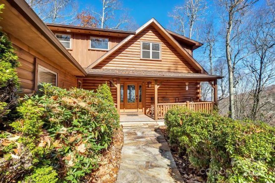 Hawks View,  a private log sided cabin in Smoky Mountain Retreat at Eagles Nest. 4BD/3BA/1HB, 4BD Septic. Multi  level decks with outstanding year round mountain views. Main level pen Floor Plan with vaulted ceilings. Stacked stone floor to ceiling wood burning which can be converted to gas. Access to main deck with fabulous year round mountain views. Dining room with views. Kitchen with quality cabinets and ample storage, granite island and counter tops and large pantry. Master on main  ensures privacy and comfort with gas fireplace and ensuite bathroom with shower and large tub. Walk in closet. Laundry room and 1/2 bath also on main level with a direct garage. Upstairs is the loft area with fabulous views and peaceful retreat, furnished w/bathroom.  2nd bedroom with views and walk-in closet and storage. 2nd bathroom on this level.  Lower level has furnished living area with  access to lower deck.  3rd bedroom with views and 4th bedroom with twin beds. 4th bathroom.
