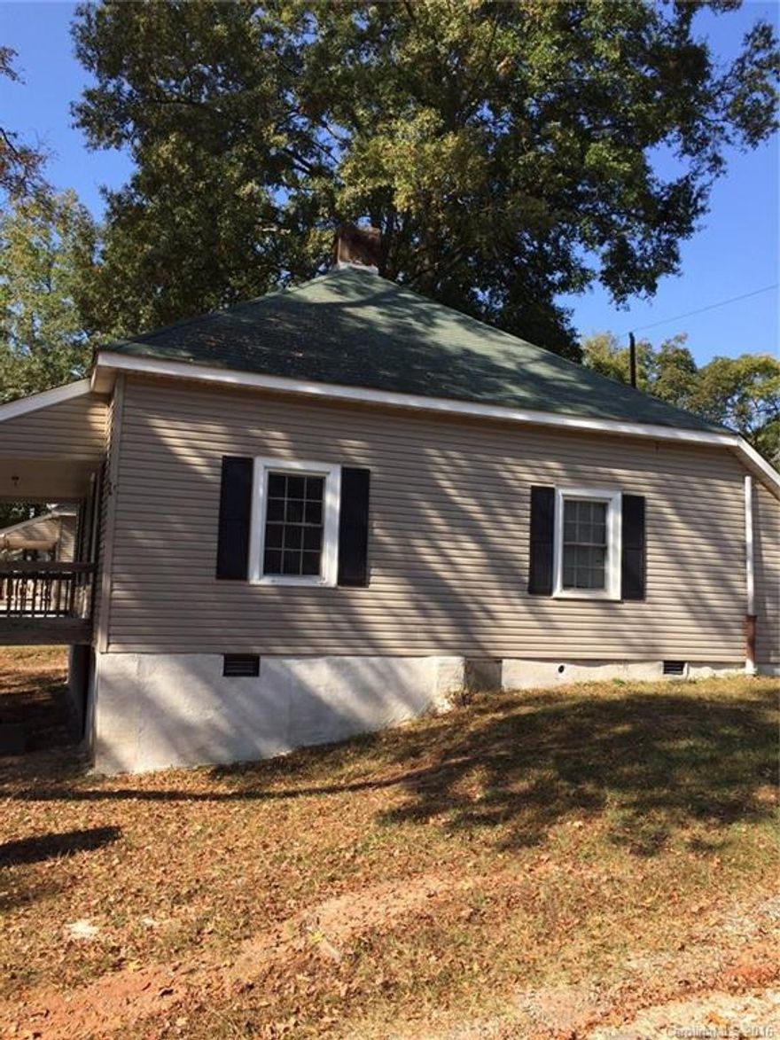 This home has been updated . It has a newer A/C heat pump, good roof, hardwood floor, carpet in bedrooms. Tile in Kitchen and bath room. Shared driveway. Comes with refrigerate and washer and dryer. All new bathroom! Move in ready. Older home selling as is.