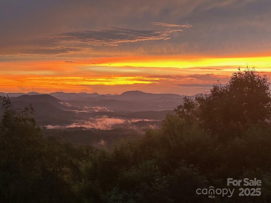 A Fantsastic 180 Degree Mountain View welcomes you to this Spacious Mountain Home. Views from almost every room. There are many upgrades throughout. The Kitchen has Bosch Stainless Appliances, Large Island, Granite Countertops and tons of Storage. Full Laundry Room with storage and sink. A large Dining area leads to a Huge Greatroom with Awesome Woodburning Fireplace and Floor to Ceiling Glass to take advantage of the Views. Primary Bedroom with walk-in Closet, another Bedroom with a full bath and nearby Powder room for Guests. Plenty of Decking to enjoy the Outdoors too. Another Stone Fireplace in the lower level and beautiful Pool table adds to Family Fun.Two more Bedrooms Perfect for Guests. One more Level down is an Exercise Room and more Storage. There is a two car Garage in the lower level and a detached Two car Garage next Door. Furnishings are available and a list of exclusions will be done by the Sellers. New Residents pay a $13k amenity fee.