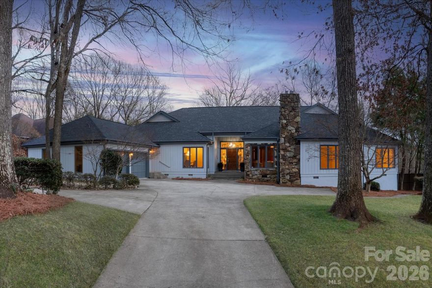 Experience refined living in this Special Contemporary Ranch nestled within the prestigious Quail Hollow community—home to the PGA Tour’s Wells Fargo Championship. Perfectly positioned on a quiet street, this residence offers exceptional privacy paired with effortless access to the neighborhood’s main entrance and the conveniences of the SouthPark area, including premier shopping, dining, and lifestyle amenities. Step inside to a sprawling layout defined by architectural character and abundant natural light. Floor-to-ceiling windows illuminate the sophisticated living spaces, highlighted by an impressive stacked stone fireplace and timeless original hardwoods throughout. Designed for both comfortable living and effortless entertaining, the open-concept floor plan flows seamlessly between the main gathering areas. The gracious dining room and private paneled study/lounge area (complete with a full wet bar) make for an ideal hosting setup. An updated, move-in ready kitchen overlooks the sparkling in-ground pool and beautifully mature landscaping, creating a picture-perfect backdrop for everyday living. The primary suite conveniently sits on the main level and features a generous reading nook, private deck, and dual closets. The ensuite bath includes a soaking tub and separate shower. Three additional secondary bedrooms are also located on the main level, offering comfortable accommodations for family and guests. A versatile bonus room upstairs—with its own full bath—serves beautifully as a fifth bedroom, media room, or private retreat. Outdoors, the backyard becomes an oasis with an in-ground pool surrounded by mature plantings that frame the space with natural beauty and privacy. A rare opportunity to own a distinguished ranch-style home in one of Charlotte’s most coveted neighborhoods.
