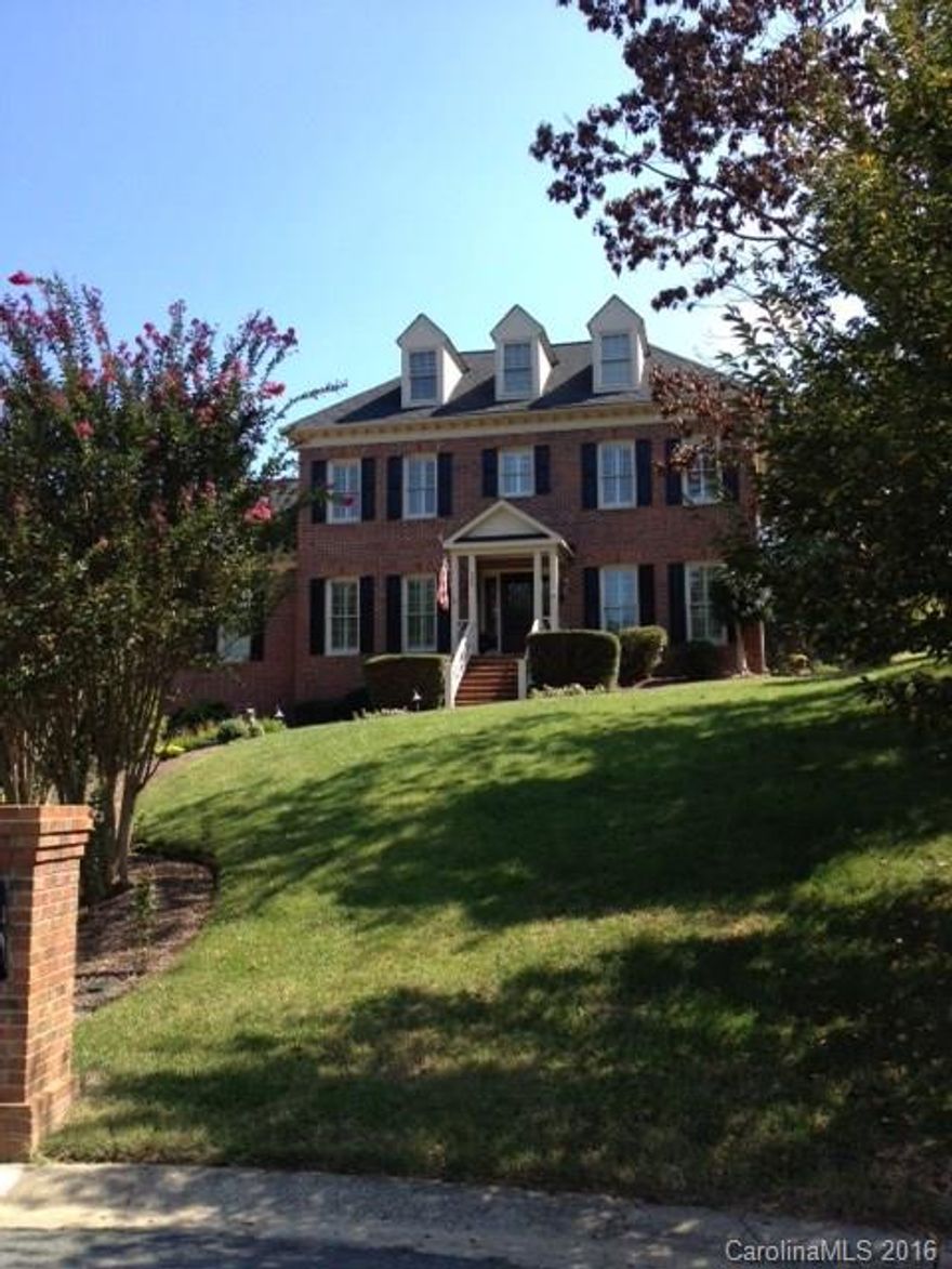 All brick custom home completely UPDATED with high-end finishes. 4BR's, 3-1/2 Baths.Beautiful hardwoods & 9' ceilings on main.Kitchen is a chef's dream boasting center island,wet bar,custom cabinets,stainless Bosch dishwasher,stainless convection oven & granite counter tops.Master on main features luxurious bath with pedestal air bath tub, dual vanities, separate frame less shower & walk-in closet. Powder room features hammered cooper sink, custom Venetian plaster, granite counter tops.