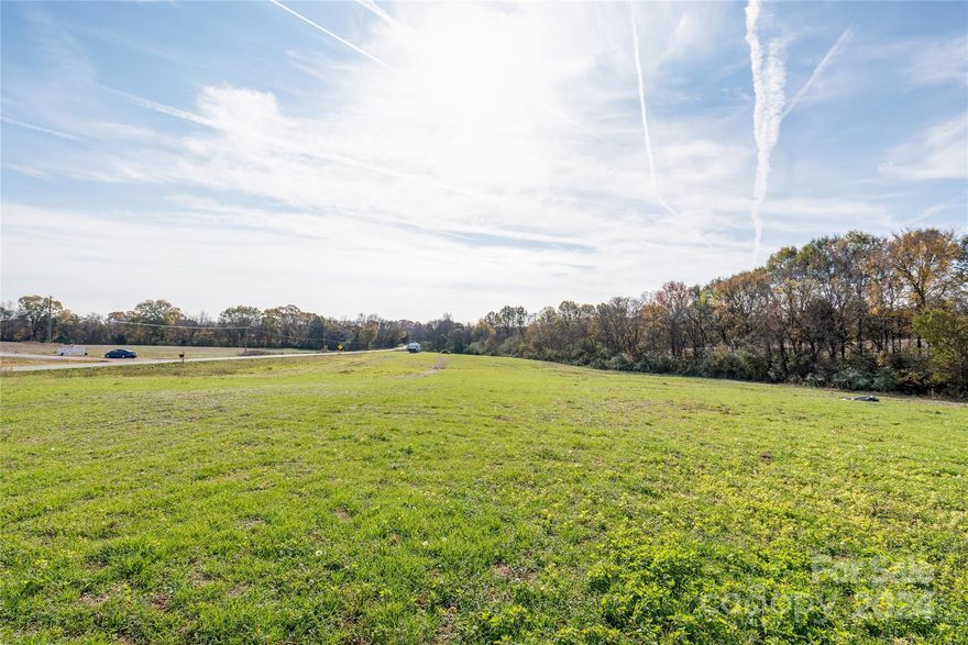 Discover the perfect opportunity to own a sprawling 5+ acre property! This beautiful parcel offers endless possibilities for your dream home. Surrounded by serene natural beauty, this land is located on Hwy 205 just off New Salem Road. Convenient connectivity to Hwy 218, a quick drive to Monroe or I-485 ensures you are  never be  too far from  the comforts of life's everyday essentials.  Included is a recorded survey & a septic system design by Thompson environmental w/paperwork approval for a 4 BR home conventional system. To maintain peace & harmony will be there for future enjoyment, the Deed restrictions requires that the home be a minimum of 1,800 heated square feet, modular or mobile homes are not allowed, & the property cannot be subdivided into parcels smaller than 3 acres. Well and Septic installation to be handled by the buyer. This beautiful 5+ acre property is a blank canvas waiting for your vision. Don't miss your chance to build your dream!