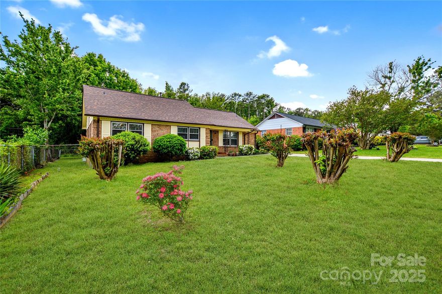 Beautifully updated ranch with 3 bedrooms and a flex space perfect for an office or optional 4th bedroom. Enjoy peace of mind with a new roof, furnace, and HVAC system (2024). Interior features include all new light fixtures, vinyl plank flooring throughout, fresh paint, and solid storm doors. The remodeled kitchen offers quartz countertops, a large single-bowl sink, new cooktop, and hood. Spacious Dining Area right next to the kitchen for gatherings. Both bathrooms have been updated with new vanities, flooring, and toilets. Updated electrical panel and washer and dryer conveys. Relax on the screened porch with ceiling fan overlooking a large, level, fenced backyard that backs to woods. An exterior shed provides extra storage. Just a short walk to Southland Park with trails, playground, and sports courts. Conveniently located near Hwy access and downtown Rock Hill.