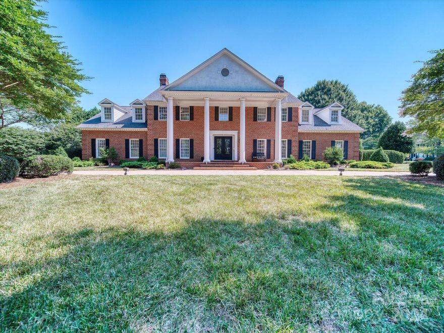 REDUCED!! Just a block from the prestigious Gaston Country Club and its award-winning golf course, this stunning Georgian-style executive home offers the pinnacle of refined living in beautiful Gastonia, NC.
This stately residence boasts so many custom features including a renovated chef's kitchen, perfect for large gatherings, featuring a keeping room for cozy conversations.
A primary bedroom suite includes a full-sized luxury dressing room and a magnificent primary closet, organized to perfection and ensuring ample space for all your attire.
In the primary bathroom, indulge in the walk-in marble shower with dual shower heads and steam feature, a spa-like retreat within your home.
An entertainer's delight, the large family room is the centerpiece for family and friends, highlighted by an amazing full bar equipped with a sink, mini fridge, and invisible wine shelving for elegant display.
** for a 3-D tour please go to the option beside documents**