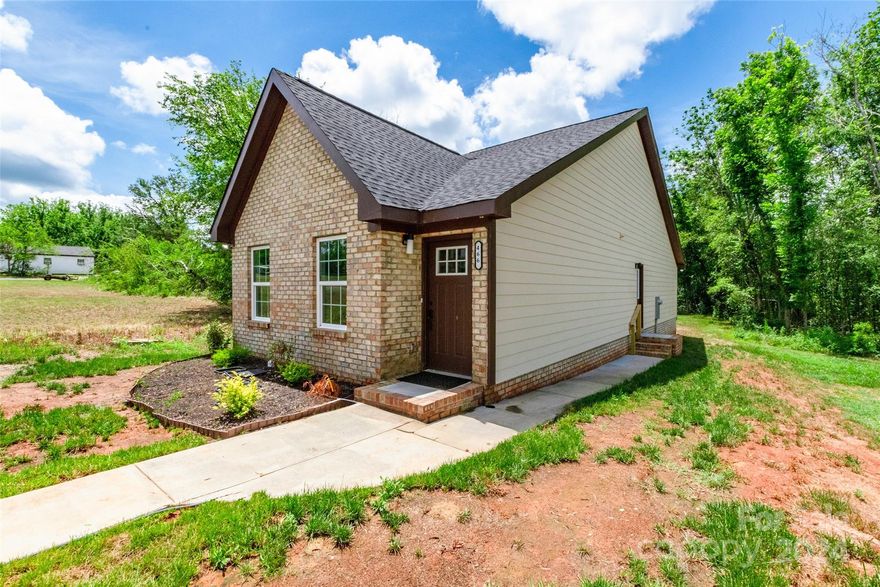 Gorgeous new construction home finished and ready for its first owner.  Luxury finishes of stone kitchen countertops and tile backsplash in the kitchen, new stainless steel appliances, accent wall in the family room, modern new light fixtures, Luxurious Large walk in tile shower, and private back yard flat for easy entertaining. Across the street from the home, is Lige Street Park, a 2.4 acre park with basketball courts, baseball fields, playground, and shelter. The lot extends past the trees all the way back to the road - the seller left the trees for privacy but will negotiate if buyer is wanting more of the lot cleared. Minutes from downtown Rock Hill and Fountain Park.