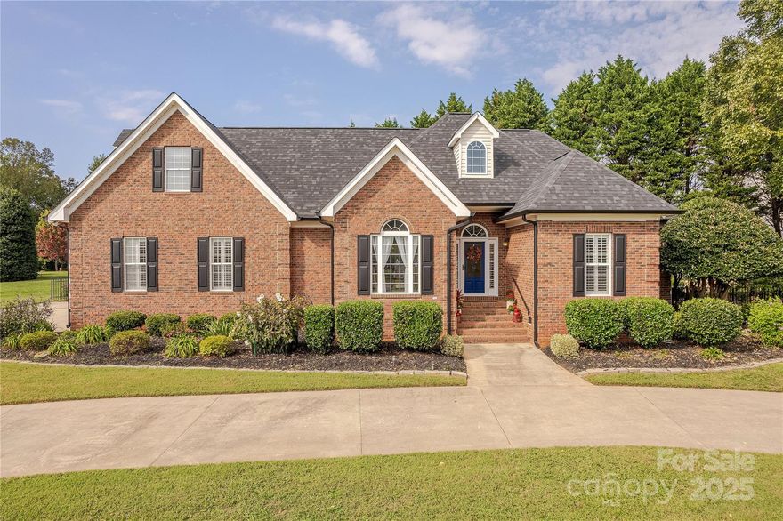 This beautiful brick one-and-a-half-story home perfectly blends elegance and comfort with 4 bedrooms and 3 full bathrooms. Rich hardwood flooring flows throughout the main living spaces, leading into a bright white kitchen complete with granite countertops, a tile backsplash, and a spacious butler’s pantry offering exceptional storage. The dining room is a true showpiece with vaulted ceilings and striking beam details, adding warmth and character.The second floor features a spacious flex space as well as another full bathroom.

The outdoor living is nothing short of an oasis. An expansive paver patio and winding pathways lead to an in-ground pool with cascading waterfall features, a tranquil stone koi pond, and a charming pergola. A relaxing hot tub completes the retreat, making this backyard ideal for both entertaining and quiet escapes.