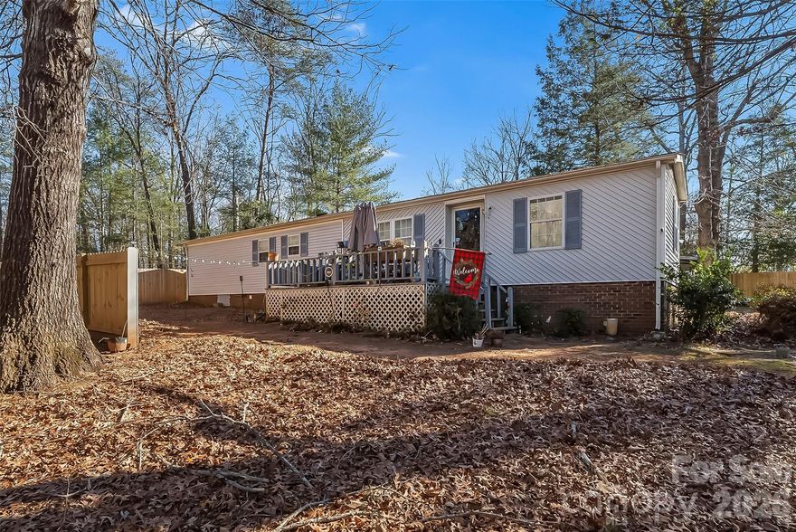 This charming 2-bedroom, 2-bath home sits on a full acre of land, offering space, privacy, and comfort, perfect for a first-time homebuyer or anyone ready to stop renting and start owning. Inside, the 934 SqFt layout is thoughtfully designed and features a stylish kitchen with granite countertops, newer appliances, and a built-in wine cooler, ideal for everyday living and entertaining. The open, inviting feel makes great use of the space, while the large lot provides endless possibilities for outdoor enjoyment, gardening, or future expansion. A convenient 2-car carport adds covered parking and functionality. Affordable, move-in ready, and full of potential and is a great place to call home!