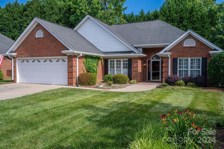 This lovely patio home features vaulted ceilings, plantation shutters, fire place, built-ins, formal dining. Modern white kitchen offers extensive  pantry and counter space. Granite counter tops and stainless appliances. Large sunroom overlooks the beautifully landscaped back yard area.