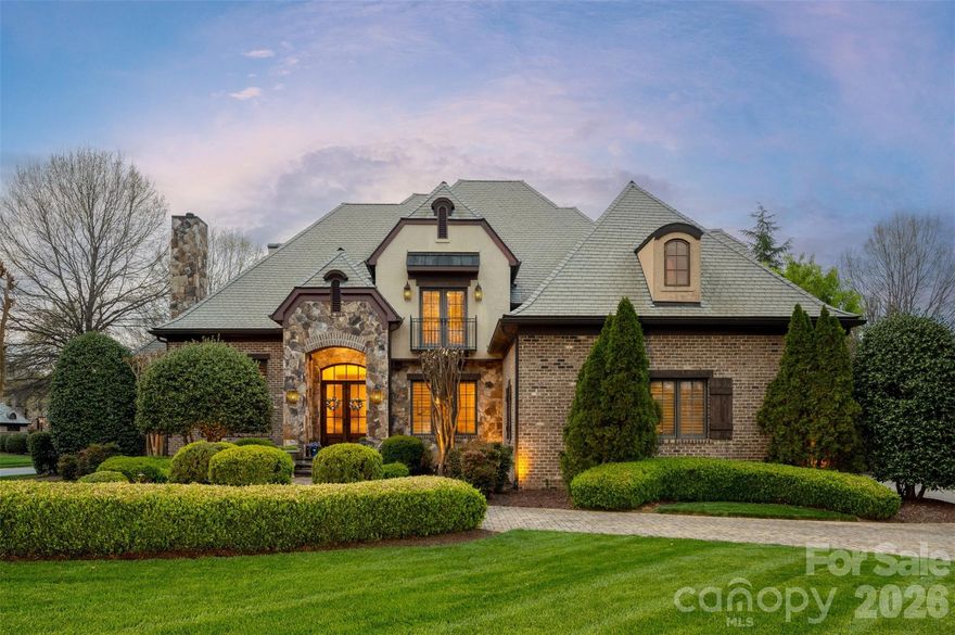 Located in the prestigious estate section of Longview Country Club, this exceptional residence showcases the same high level of craftsmanship and architectural detail found throughout the community—perfectly positioned on a private, fenced ½-acre lot with a circular driveway.

Inside, timeless elegance meets everyday functionality. A richly appointed office features detailed wood paneling, a coffered ceiling, and a striking stone fireplace, while the formal dining room impresses with classic wainscoting. Plantation shutters throughout add both charm and sophistication.

The open-concept layout is designed for effortless living and entertaining. A light-filled kitchen offers granite countertops, a center island, and stainless steel appliances, flowing seamlessly into the family room and breakfast area, with direct access to a screened-in side porch. A cozy keeping room overlooks the private backyard, creating an inviting space to relax. With three fireplaces throughout the home, warmth and ambiance are always within reach.

The spacious primary suite is a true retreat, complete with separate walk-in closets, a soaking tub, dual vanities, and plenty of room to unwind. Upstairs, three generously sized secondary bedrooms each feature their own private en-suite baths, offering comfort and privacy for family or guests.

Entertainment and flexibility abound with a fully equipped home theater featuring a projector, along with additional flex space ideal for a gym, craft room, or second office.

Fully fenced, private backyard features a covered pavilion with a large lounging area and gorgeous outdoor wood burning stone fireplace.

Residents of Longview enjoy a premier lifestyle with access to an 18-hole Jack Nicklaus signature golf course, dining, fitness center, pools, tennis, and a youth lodge. 

Refined living in one of the area’s most sought-after communities.