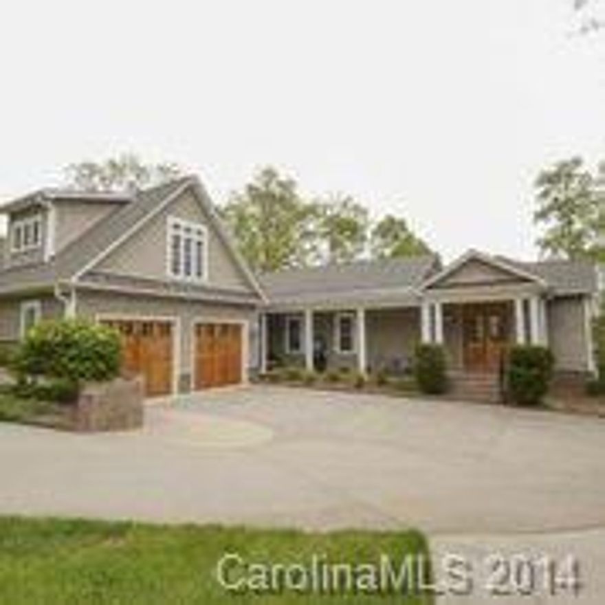 Stunning waterfront home w/ exquisite views of the lake. Casual elegance abounds w/ maple hrdwds,  moldings & vaulted ceilings.  Gourmet kitchen, maple 55" cabinetry, granite tops, distressed wood center-isle & a wet bar w/ 2nd oven & wine frig.  Master BR has pine cathedral ceilings, wall of windows. A perfect place to relax & enjoy the tranquility that Lake Wylie has to offer!