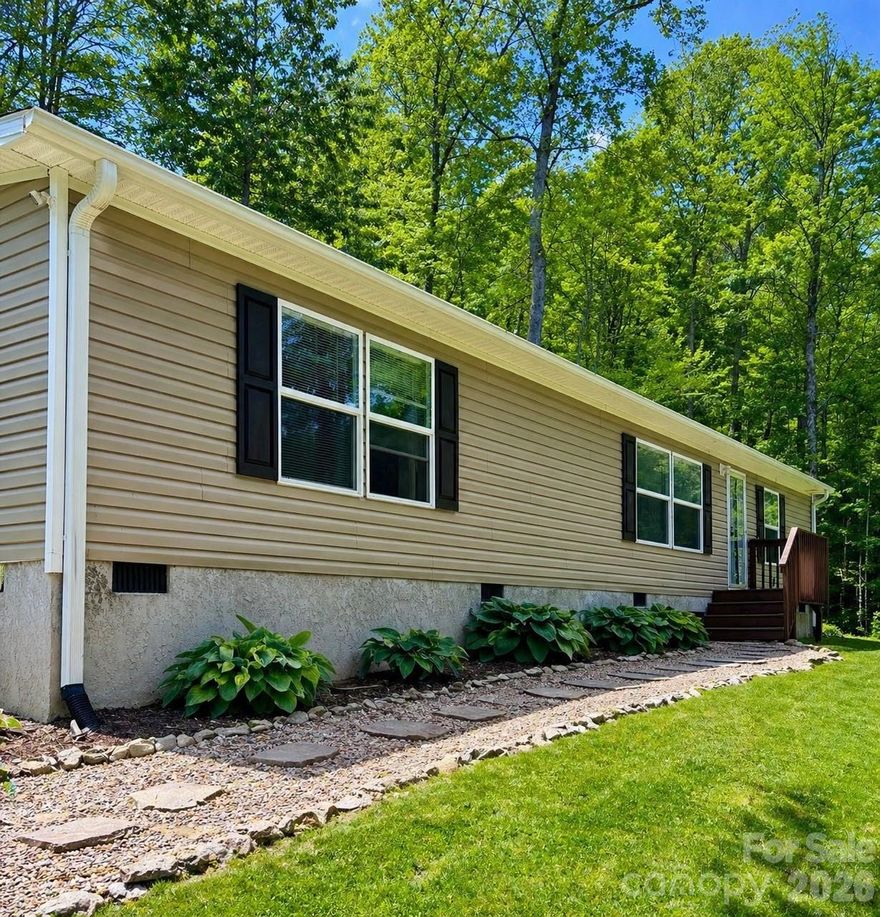 Motivated sellers have proactively completed a prelisting inspection for buyer peace of mind and a smoother path to closing- no road blocks or unwanted surprises.

Private acreage, usable land, and room to grow. This is the kind of property that’s getting harder to find in Haywood County.

Situated on 3.36 acres, 256 Inglewood Cove Rd offers a rare combination of space, privacy, and functionality. The land has been extensively improved to create a true, usable yard—giving you room to gather, relax, and actually enjoy the outdoors without the limitations of typical mountain terrain.

This well-maintained 2018 home features a bright, open layout with updated fixtures in the kitchen, bathrooms, and dining area, creating a clean and cohesive feel. The primary bedroom includes a dedicated flex space addition currently used as an office—ideal for remote work, hobbies, or additional living needs. Note: walls to the flex space in the office are easily taken down.

Beyond the home itself, the property continues to stand out. With ample parking and generous acreage, there is potential for a future build site (buyer to verify), making this an excellent option for those thinking long-term—whether for a guest home, investment, or expansion.

Located just 10 minutes to both Waynesville and Maggie Valley, you get the best of both worlds: privacy and convenience. Asheville is also within easy reach for dining, shopping, and entertainment.

Light HOA with well-maintained roads and snow removal adds to the ease of living here year-round.

If you’ve been looking for usable land, flexibility, and a move-in ready home in a peaceful setting, this property delivers a unique opportunity.

Note: While Zillow indicates a flood zone, the current owner does not carry flood insurance.
