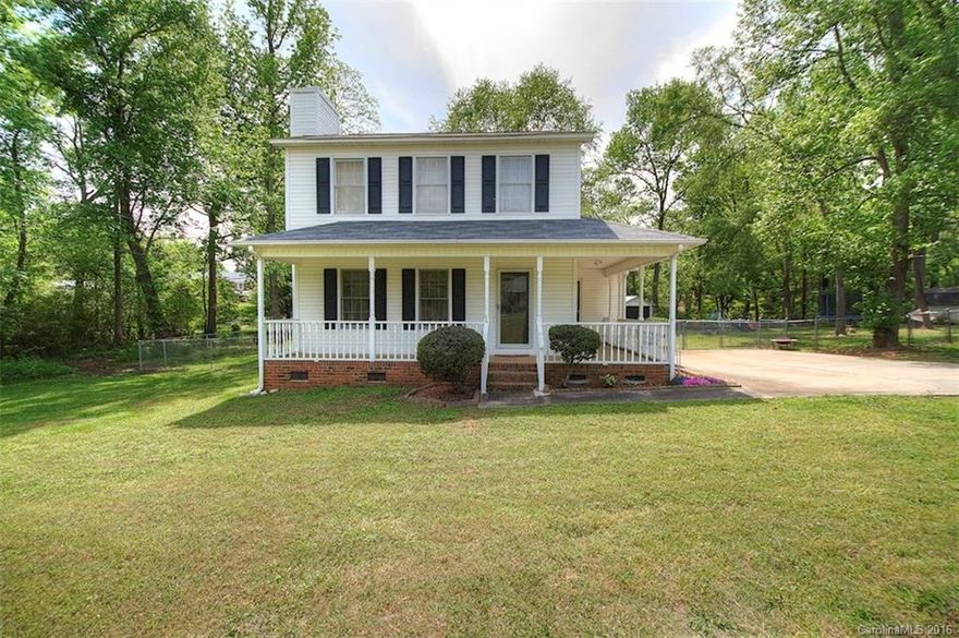 Traditional 3BR/2BA home on .30 acres of land in Rock Hill. Beautiful lot with privacy and mature trees. Rocking chair wrap around front porch, large extended back deck with built in seating overlooking fenced back yard. Living room features fireplace, abundant natural light, direct access to dining and kitchen. All 3 bedrooms and 1 full bath upstairs, 1 full bath downstairs. Move in ready home with neutral features in excellent location.