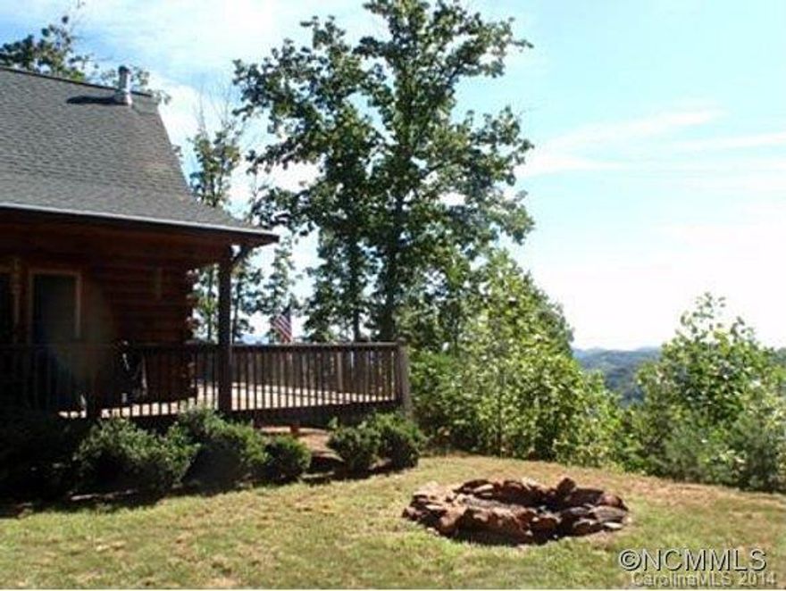 About 1 1/2 hour from Charlotte in the foothills, not far from the GSA Camp you'll find this log cabin with 10 acres. One large sleeping loft, one bathroom upstairs, open floor plan with real wood heat. Some furniture and appliances, there's a great long range winter view of the South Mountains and in the summer you're tucked into a forest. Covered porches in front and back expand the living area. Storage building stays. Paved roads and drive!