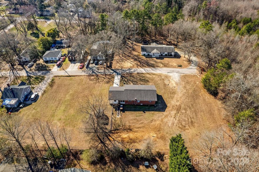 Lot divided from 208 W 19th St.  Lot 1 is closest to tree line in picture.