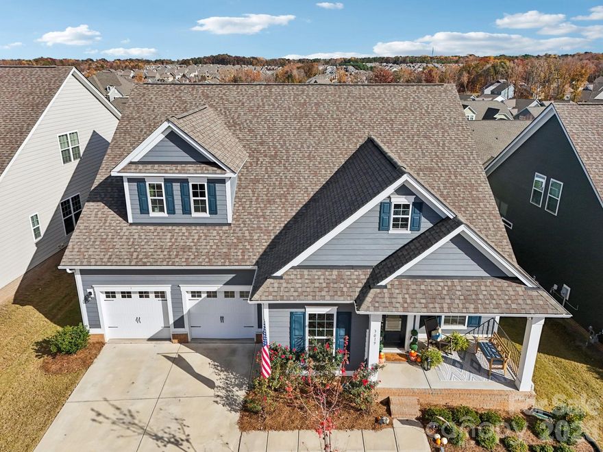 Welcome to this impeccably maintained and beautifully curated 4-bedroom home with a private office, offering refined living spaces, exceptional craftsmanship, and peaceful outdoor living in one of Waxhaw’s most sought-after communities.
Thoughtfully designed with both elegance and functionality in mind, the open-concept floor plan seamlessly connects the main living areas and is enhanced by soaring tray ceilings, rich crown molding, detailed wainscoting, upgraded casings, and beautiful modern hardwood flooring throughout the main level. The inviting living room is anchored by a cozy fireplace and flows effortlessly into the casual dining area, all overlooking the serene backyard.
At the heart of the home, the gourmet kitchen is truly designed to impress — featuring granite countertops, expansive island seating, 48-inch soft-close cabinetry, gas cooktop, designer pendant lighting, a butler’s pantry, and a custom walk-in pantry with specialized shelving for optimal organization and storage.
The main level also features a stunning formal dining room, ideal for entertaining, along with a luxurious primary suite and an additional guest bedroom with a full bath, creating the perfect setup for guests or multigenerational living.
The spacious primary retreat offers a spa-inspired experience with dual marble-topped vanities, premium finishes, and a luxurious walk-in shower featuring dual shower heads and built-in seating.
Upstairs, you’ll find two generously sized secondary bedrooms, a full bath, an oversized loft, and a spacious bonus room — perfect for a media room, playroom, second office, fitness space, or potential fifth bedroom.
Outdoor living is equally impressive, with a covered porch overlooking professionally designed landscaping, a beautiful patio area, and a fully fenced backyard offering both privacy and tranquility. Smart-home upgrades throughout the property provide added convenience and modern functionality.
Located in the heart of MillBridge, residents enjoy award-winning, resort-style amenities including an incredible clubhouse with a theater and staffed coffee bar, state-of-the-art fitness center, covered basketball court, tennis courts, pools, walking trails, playgrounds, and vibrant community events throughout the year.
All of this just minutes from the charm, shopping, and dining of historic downtown Waxhaw.