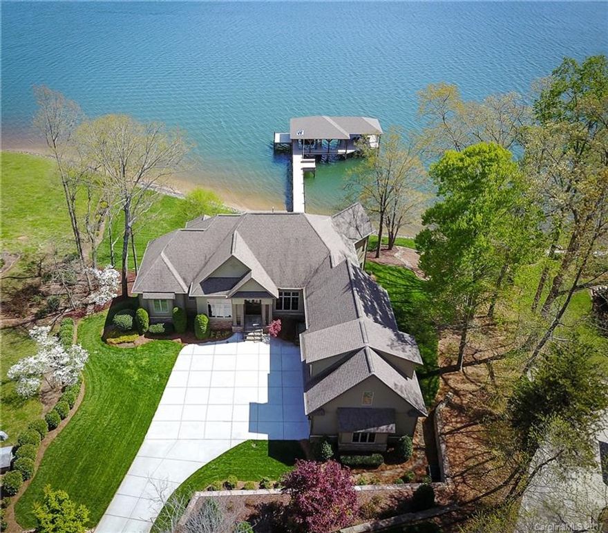 If you started from scratch, You'd build one of the largest, most magnificent docks on LKN. You'd strategically position each space to wide open channels of the lake. The finest materials & highest-skilled tradesman would be hand selected. You'd be describing our listing being introduced to the market! Dock offers a total of 2122 sf w/sunbathing pad, seating, lift, lounging area & steps to the Lake. Great 2nd living quarters in basement. Click video real icon for 3D Design!Brand New Private Well