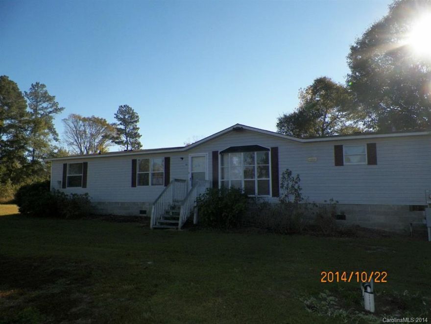 Don't miss this spacious DW Manufactured home located in a rural area of Sumter County, S.C.  The easement driveway leads to the home that features a large side and rear deck.  Make it your home with your own update/renovation ideas.  It also features a spacious kitchen, dining room, living room, den with fireplace, three bedrooms and two baths.