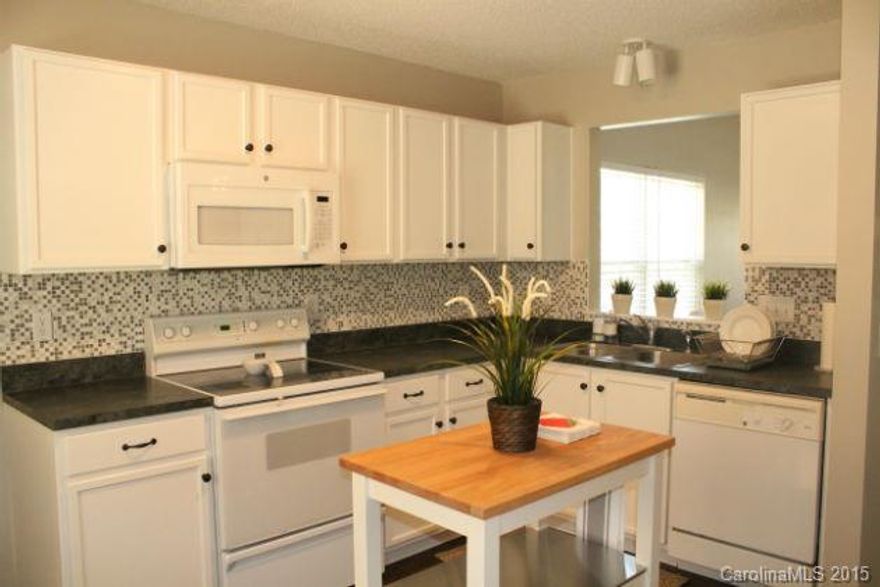 Beautiful home with so many updates you would think it was new! Open floor plan with large kitchen. Home has gorgeous new laminate hardwood floors, new tile floors, new carpet, new tile backsplash, house interior freshly painted, outside shutters and front door freshly painted, new light fixtures, and some new ceiling fans, new built-in microwave. This house is adorable and will not disappoint -- a must see!