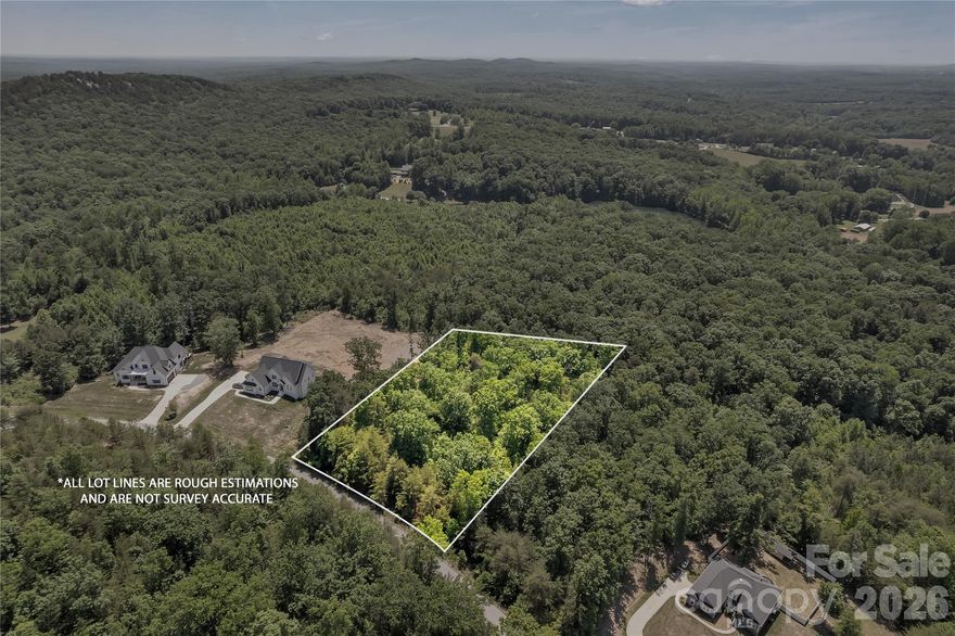 Secure peace of mind and long-term equity with this 1.84-acre homesite at 523 Alex D. Owens Dr. Backing directly to protected Crowders Mountain land, your views—and privacy—are permanent. No future backyard development, just a natural sanctuary.

The lot offers a wide, balanced shape for true design flexibility—ideal for a custom home. Surrounded by established luxury homes and a 2,000+ heated sqft minimum, the neighborhood is built to protect value.

Enjoy quiet foothills living just minutes from the expanding Catawba Two Kings Casino. Easy access to I-85 and Charlotte makes this a rare blend of privacy and smart investment.