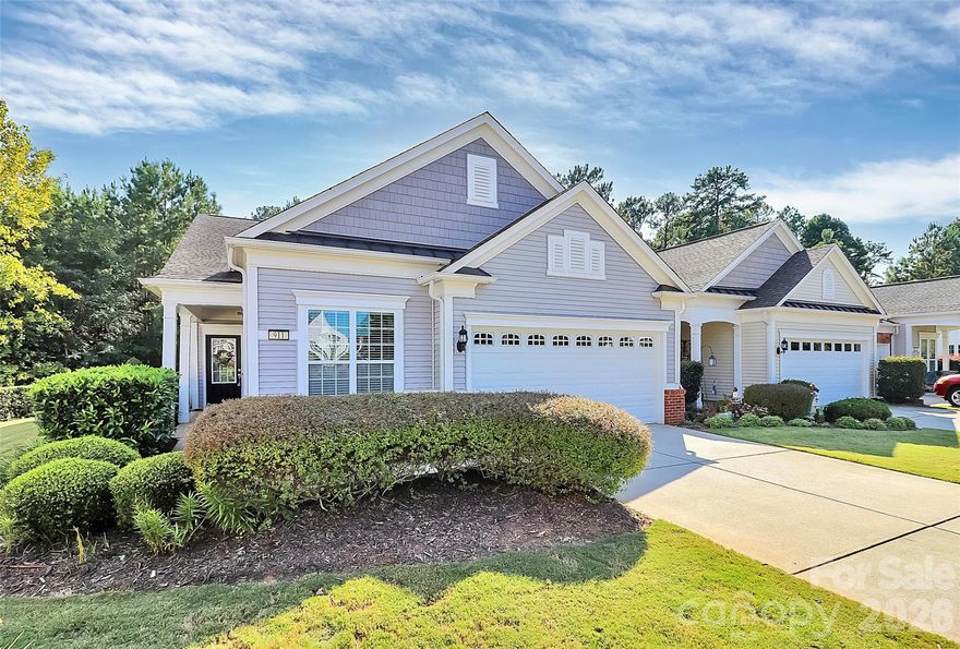 Discover the comfort, freedom, and peace of mind you deserve in this beautifully maintained end-villa located in the highly sought-after Villa section of Sun City Carolina Lakes. Designed for easy single-level living and peaceful wooded view in the rear of the home, this lovingly cared-for home offers the relaxed lifestyle so many dream about in retirement.

Wake up each morning to quiet natural scenery and enjoy your coffee in a private backyard with no direct rear neighbors. Tucked away on a quiet cul-de-sac, this special homesite offers rare privacy while still being just a short scenic walk to the Lakehouse and community amenities.

Inside, the home feels warm, fresh, and move-in ready with beautiful new hardwood floors in the kitchen and dining room, fresh paint, and new carpet in the office. The bright, open kitchen flows into a cheerful sunroom/flex space—perfect for reading, hobbies, puzzles, or visiting with friends and family. A dedicated home office provides flexibility for crafts, guests, or staying connected with loved ones.

The spacious ranch-style layout features two generously sized bedrooms, including a peaceful owner’s suite with a private ensuite bath designed for comfort and convenience. An attached two-car garage offers excellent storage and easy everyday access.

One of the greatest advantages of this home is the truly carefree lifestyle. The HOA includes exterior maintenance, roof care, and lawn maintenance—allowing you to spend less time on chores and more time enjoying life. Whether you love traveling, socializing, golfing, exercising, or simply relaxing, life at Sun City Carolina Lakes offers an active 55+ lifestyle filled with resort-style amenities, clubs, fitness, social events, walking trails, and endless opportunities to connect with neighbors and friends.
Don’t miss your opportunity to enjoy the easy, low-maintenance lifestyle you’ve worked so hard for.

Plus, the seller is offering a $5,000 closing cost credit with an acceptable offer!