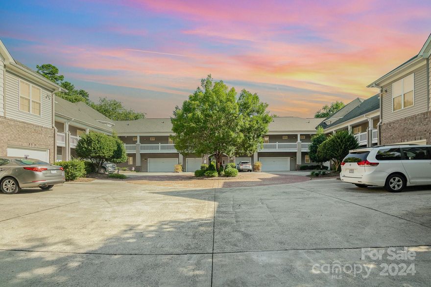 Nestled in the heart of Cornelius, this charming 3-bed/2-bath condo features a spacious 1-car garage & a generous, covered wrap-around porch. The European Courtyard-style building offers single-level living at its finest! The interior is enhanced with neutral paint, updated flooring, lighting & HVAC system, all complementing the open floorplan that is bathed in natural light. The kitchen is well-appointed with ample cabinets, counter space & pantry. The dining area showcases a new light fixture, while the living room is designed for comfort with a ceiling fan, gas fireplace, and direct access to the covered porch. The primary bedroom is a retreat, featuring a tray ceiling, ceiling fan, large walk-in closet, and a private bathroom with dual sinks, a jetted tub, and a separate shower. Two additional bedrooms share a full bath with a tub/shower. The building also includes an elevator for added convenience. Community amenities include a pool, clubhouse & access to Greenway walking trails.