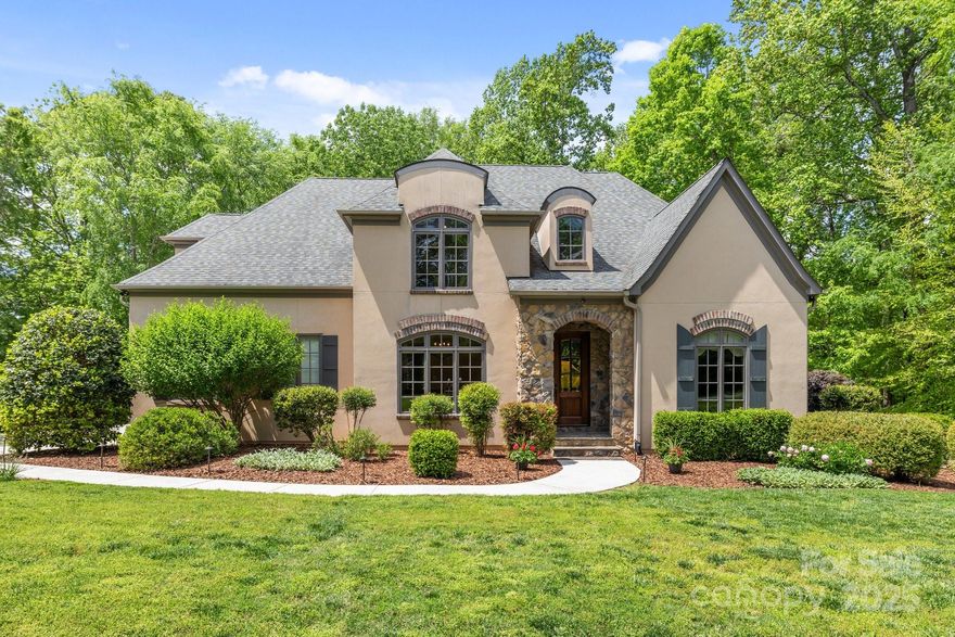 Nestled on a generous lot in Matthews and within walking distance of a top-rated elementary school, this stunning home offers the perfect balance of luxury and convenience. With elegant curb appeal, the residence blends timeless European charm with modern living. Inside, high-quality craftsmanship throughout, with no detail overlooked. The custom chef’s kitchen is a standout, complete with a large center island, stainless steel appliances, dual sinks, and a spacious breakfast room plus scullery. Wide-plank oak floors and rich trim work add warmth and character to every room. The finished lower level is designed for entertaining, featuring a full media area, wet bar, exercise study/bedroom and a cozy rec room with a beautiful stone fireplace. Entertain in style with a serene backyard and multiple outdoor living spaces, including a built-in gas grill, fire pit, and stone hardscaping perfect for year-round enjoyment.Tankless water heater, THREE CAR Gar, NO HOA!Seller is a licensed Broker.