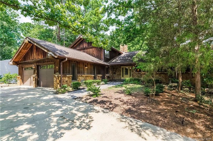 Custom built cedar and Arkansas Stone one-owner contractor home exudes quality craftsmanship.  Main and lower levels open onto large deck and pool area, wonderful for entertaining.  Features include continuous hot water; centralized vacuum; large eat-in kitchen with two ovens, granite countertops, and custom cabinets; abundant storage; bedrooms on each level; walk-out basement with self-contained shop with separate entrance; Pella windows; and a natural, landscaped yard with circular drive.