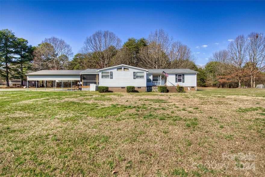 This beautiful 3 Bedroom, 2 Bath Home is minutes from Lake Norman! Lovingly maintained & includes updates galore! Flooring throughout most of home has been updated to pre-finished Bamboo. Welcoming Family Room includes a beautiful Stone Fireplace. Dining Area accommodates a large table for those special events. Kitchen completely remodeled in 2015 with gorgeous Cherry cabinetry, Eat at Island, Granite countertops, updated lighting, Stainless Steel sink & appliances, including the Refrigerator! Mudroom has matching Cherry built-ins & Laundry hookups. Primary Suite Bath, remodeled 2015, features an incredible cultured marble shower w/double showerheads, double cultured marble sinks in Cherry cabinetry, private water closet, updated lighting, tile flooring. Rear Screened Porch/Double Carport added 2019. Most windows & sliding glass doors replaced 2015. New roof 2017; HVAC 2019. *In process of removing old lien on property, may result in extended closing. CASH buyers only at this time*