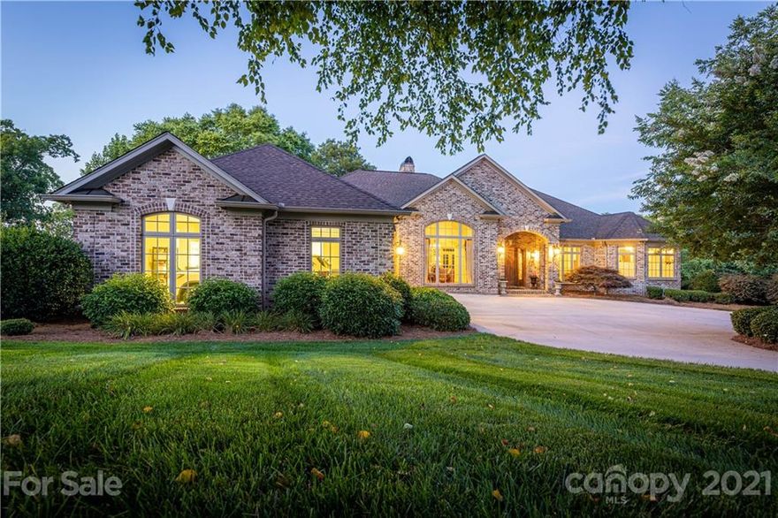 ONE OF A KIND CUSTOM EXECUTIVE WATERFRONT HOME LOCATED ON A CUL DE SAC OVERLOOKING THE MAIN CHANNEL OF LAKE HICKORY. ELEGANT ENTRY LEADS YOU INTO A HOME WITH HIGH END FINISHES AND EVERY POSSIBLE UPGRADE. THERE ARE VIEWS FROM JUST ABOUT EVERY ROOM IN THE HOUSE WITH LARGE WINDOWS AND DOORS OPENING ONTO SPECTACULAR BALCONIES OVERLOOKING GADENS AND WATER VIEWS. WALK THROUGH THE SPACIOUS ROOMS ACROSS LUXURIOUS BRAZILIAN CHERRY FLOORS. THE GOURMET KITCHEN HAS VIKING DOUBLE OVEN AND COOKTOP AS WELL AS ADDITIONAL WALL OVEN AND WARMING DRAW. YOU WILL HAVE PLENTY OF ROOM FOR FOOD WITH A SUB ZERO FRIG AND TWO ADDITION REFRIGERATED DRAWS UNITS. THE HOUSE HAS A SPLIT BEDROOM LAYOUT WITH THE MASTER SUITE OCCUPYING ONE WHOLE SIDE OF THE HOUSE. THERE IS A SECOND KITCHEN IN THE LOWER LEVEL FOR INFORMAL ENTERTAINING AS WELL AS A QUEST SUITE FOR VISITORS. IF YOU ARE A BOATER YOU WILL LOVE THE COVERED BOAT DOCK WITH LIFT AND TWO SLIPS. THIS IS ONE OF THE NICEST HOME ON THE LAKE WAITING FOR A NEW OWNER.